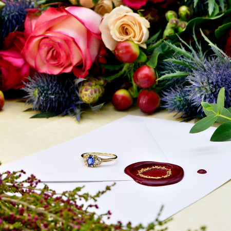 The Contemporary Synthetic Sapphire and Two Diamond Ring - Antique Jewellers