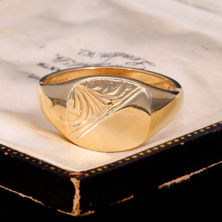 Front view of vintage 9ct gold signet ring with diagonal engraved swirl motif