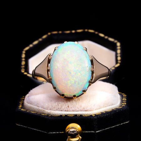 Front view of vintage 9ct gold white opal solitaire ring with claw setting