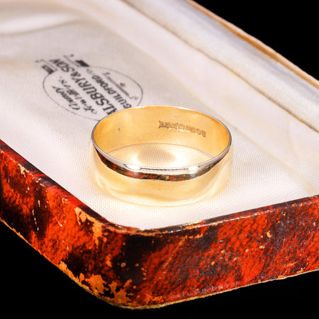 Hallmark stamps on inner band of 9ct gold D-shape wedding ring