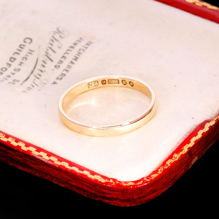 Hallmark stamps reading HS, 9ct, 375 on inner band of gold wedding ring