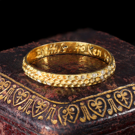 Interior inscription reading "By This Token You Are Bespoken" on gold posy ring