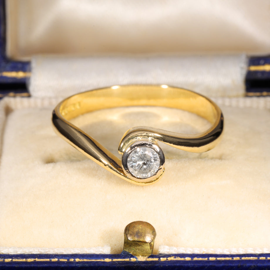 The Vintage 1996 Brilliant Cut Diamond Solitaire Swirl Ring