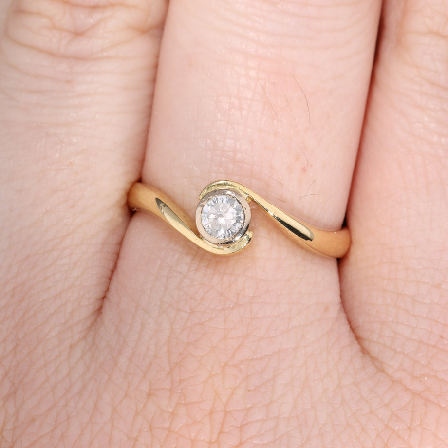 The Vintage 1996 Brilliant Cut Diamond Solitaire Swirl Ring