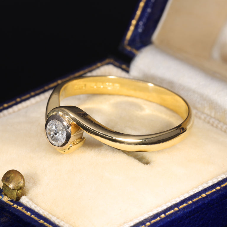 The Vintage 1996 Brilliant Cut Diamond Solitaire Swirl Ring