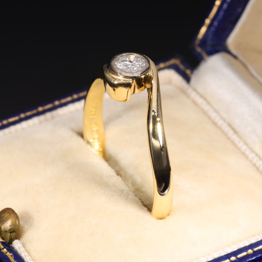 The Vintage 1996 Brilliant Cut Diamond Solitaire Swirl Ring