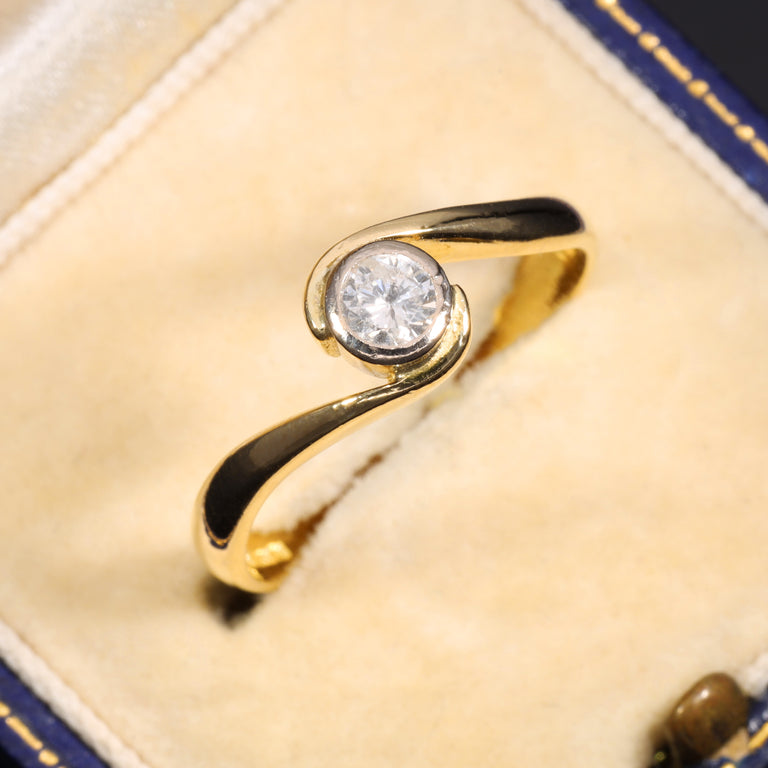 The Vintage 1996 Brilliant Cut Diamond Solitaire Swirl Ring