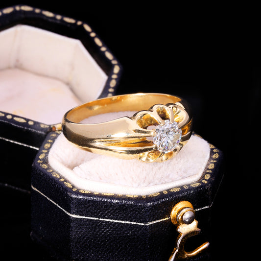Three-quarter view of 18ct gold diamond solitaire in buttercup setting