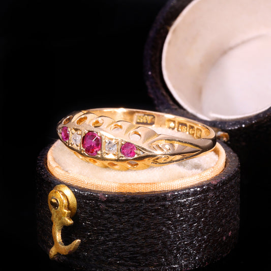 Three-quarter view of Edwardian 18ct gold ruby and diamond five-stone boat ring
