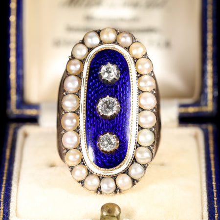 Georgian mourning ring with blue guilloché enamel, three old-cut diamonds, white enamel border, and natural pearl surround, circa 1789
