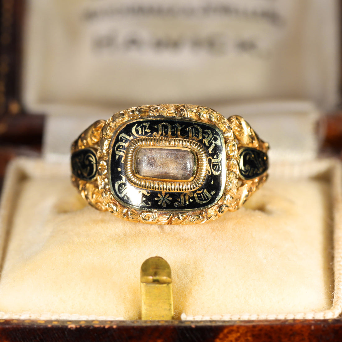 Georgian mourning ring with black enamel In Memory Of inscription in gold lettering and central hair panel