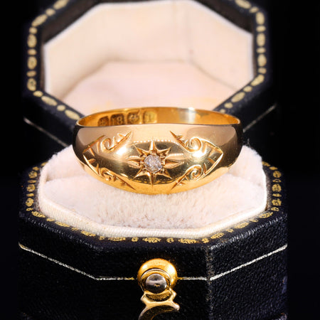 Victorian 18ct gold diamond star ring dated 1864, with gypsy-set old cut diamond in star-shaped incision and visible hallmarks on the inner band
