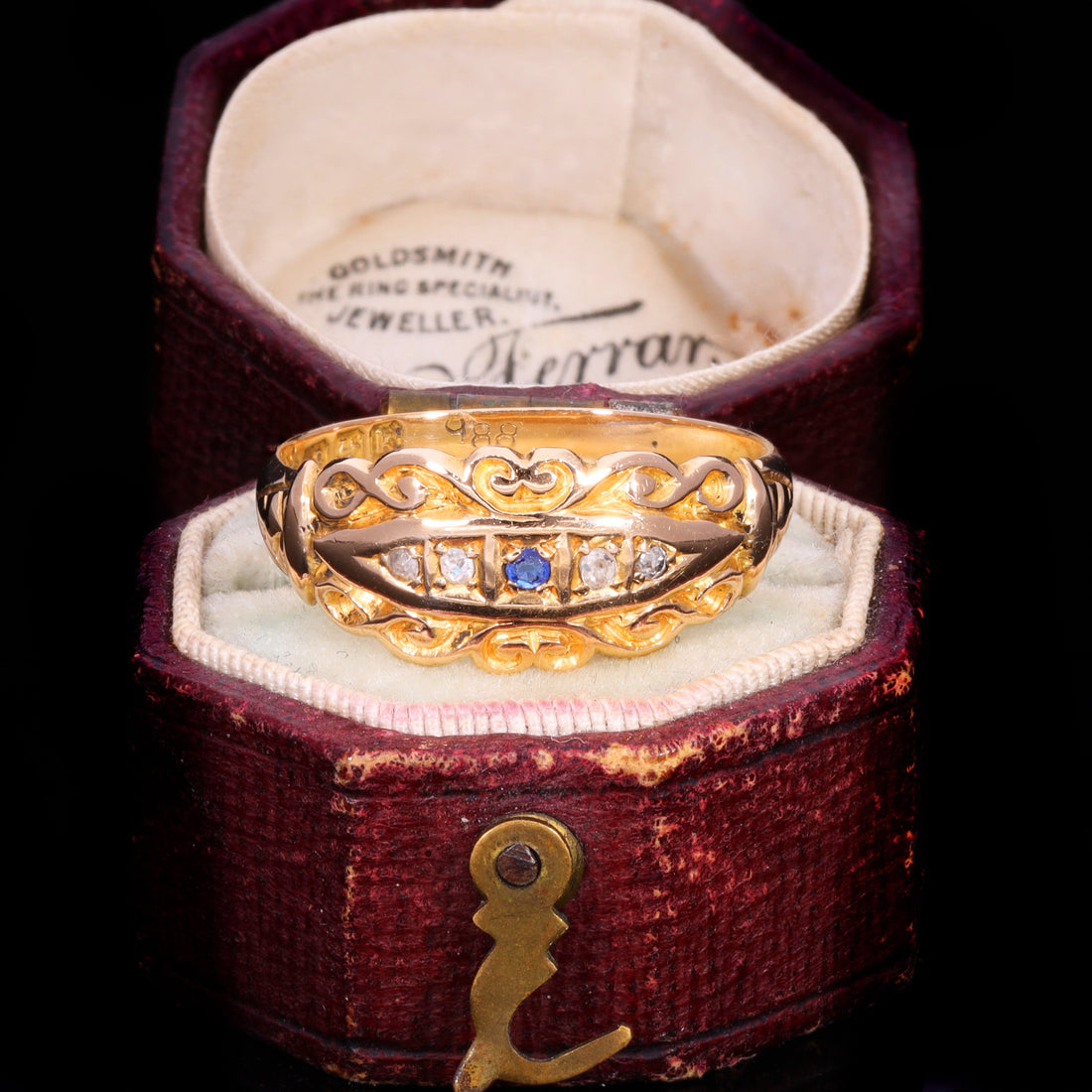 Edwardian sapphire and diamond scrollwork ring in 18ct gold, circa 1909