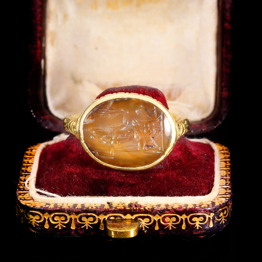 Stuart period gold intaglio ring with Jupiter carved into onyx, circa 17th century, displayed in its original antique box with red velvet lining