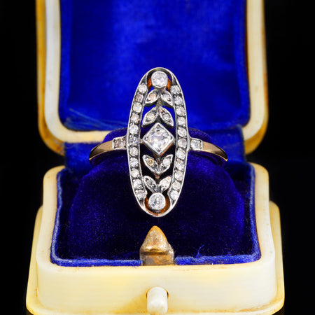 Art Deco diamond navette ring with geometric floral design in white metal over gold, featuring thirty-five diamonds arranged in a symmetrical elongated bezel