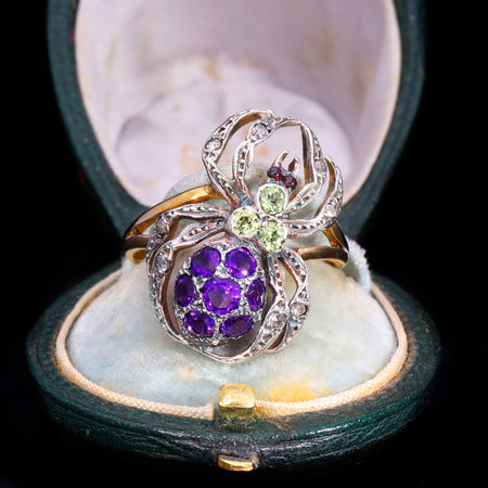 Front view of vintage amethyst, peridot, garnet and diamond spider ring