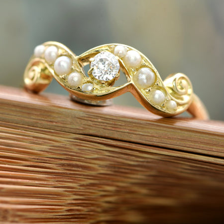 The Early 20th Century Ten Pearl And Diamond Solitaire Ring - Antique Jewellers