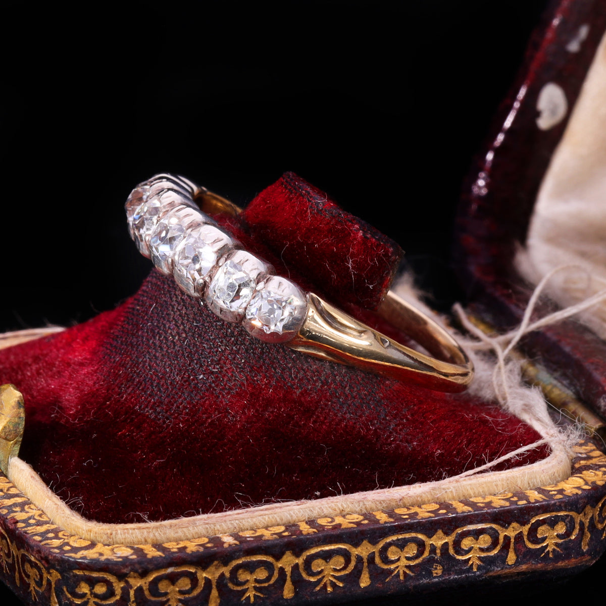Side profile of Victorian eight-stone old mine-cut diamond half hoop ring