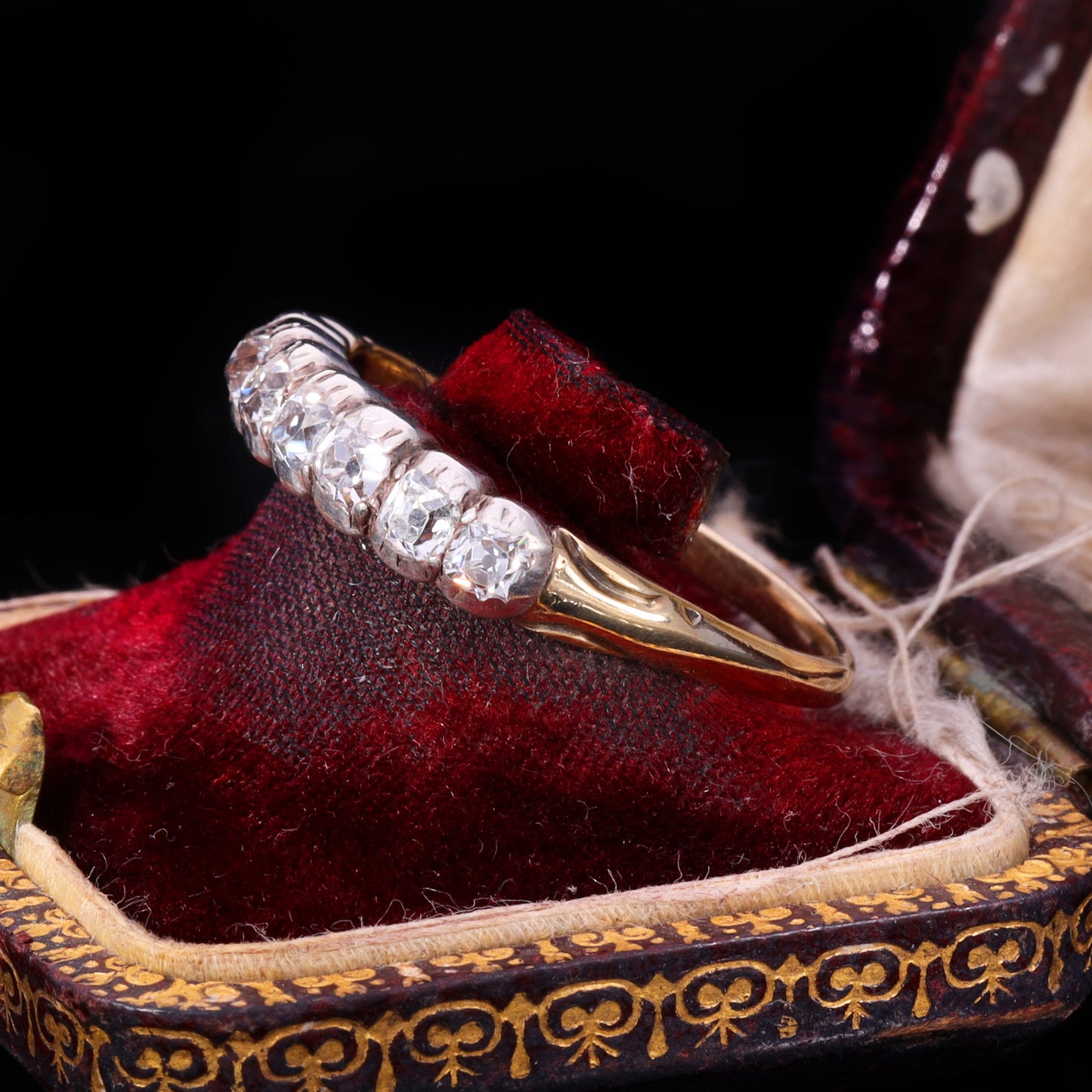 Side profile of Victorian eight-stone old mine-cut diamond half hoop ring