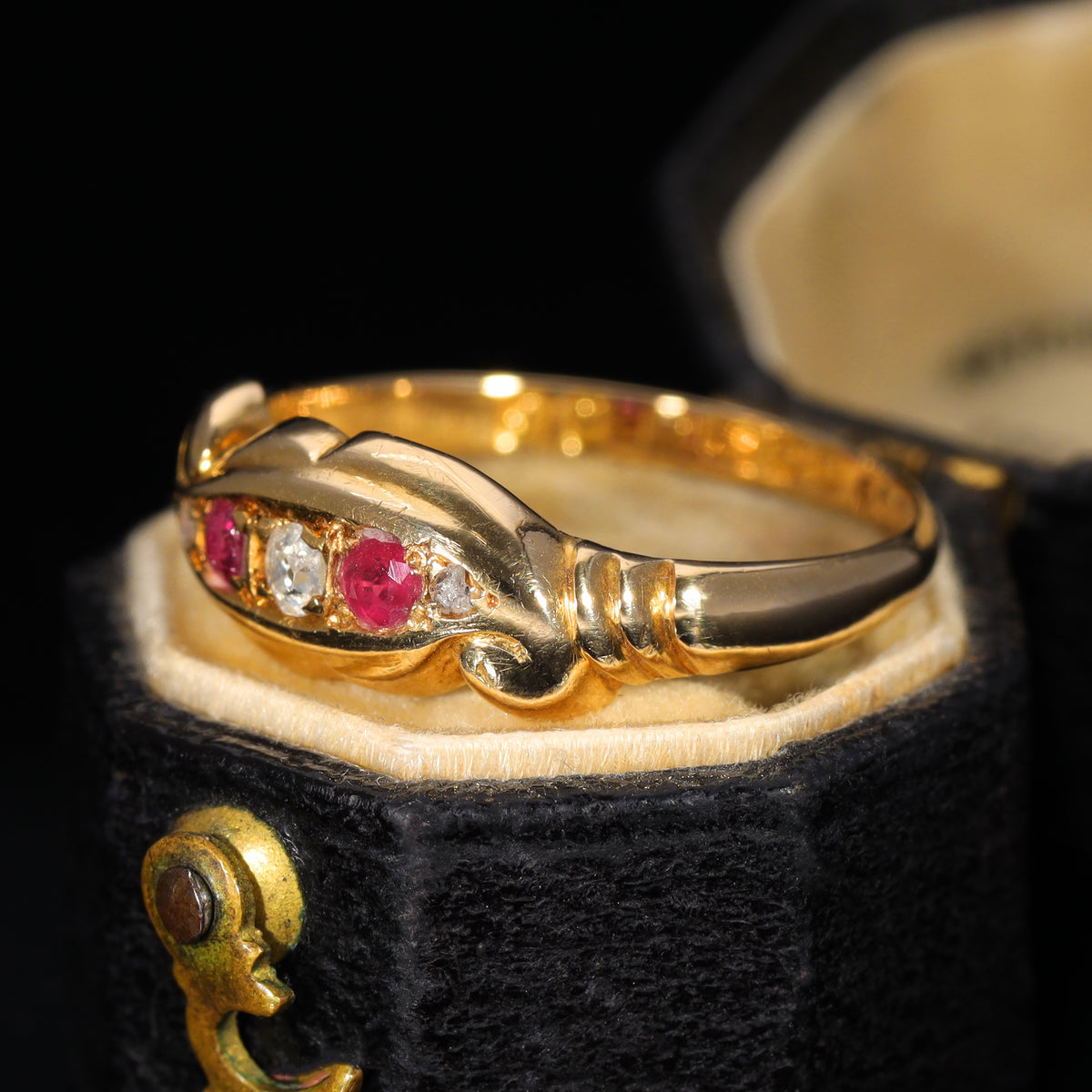 The Antique 1919 Diamond and Ruby Scroll Ring