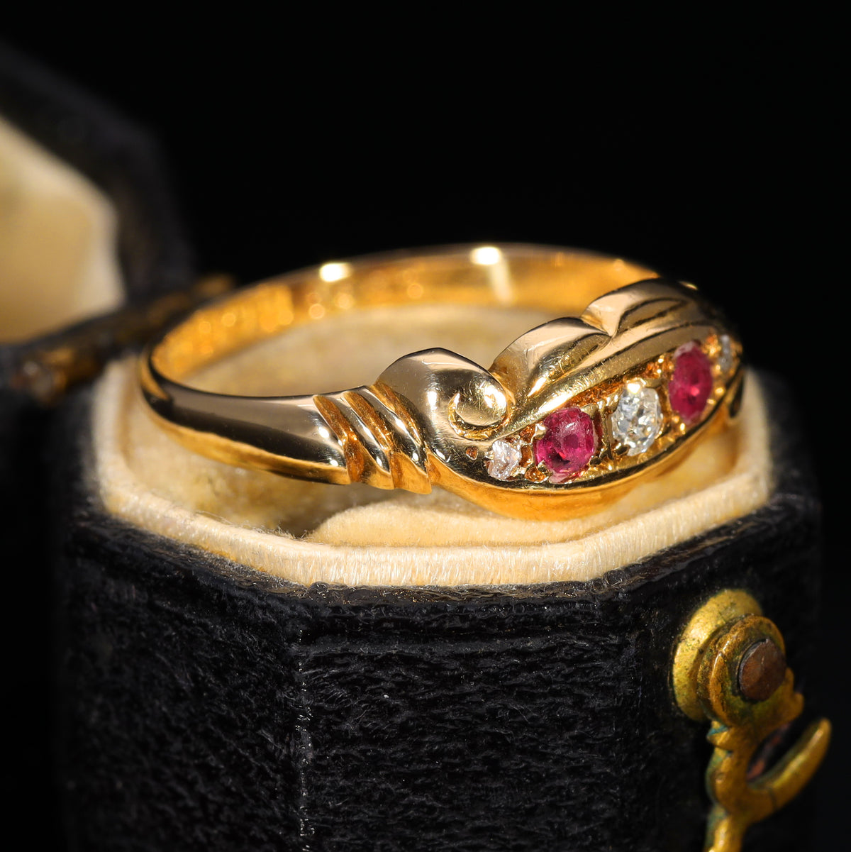 The Antique 1919 Diamond and Ruby Scroll Ring