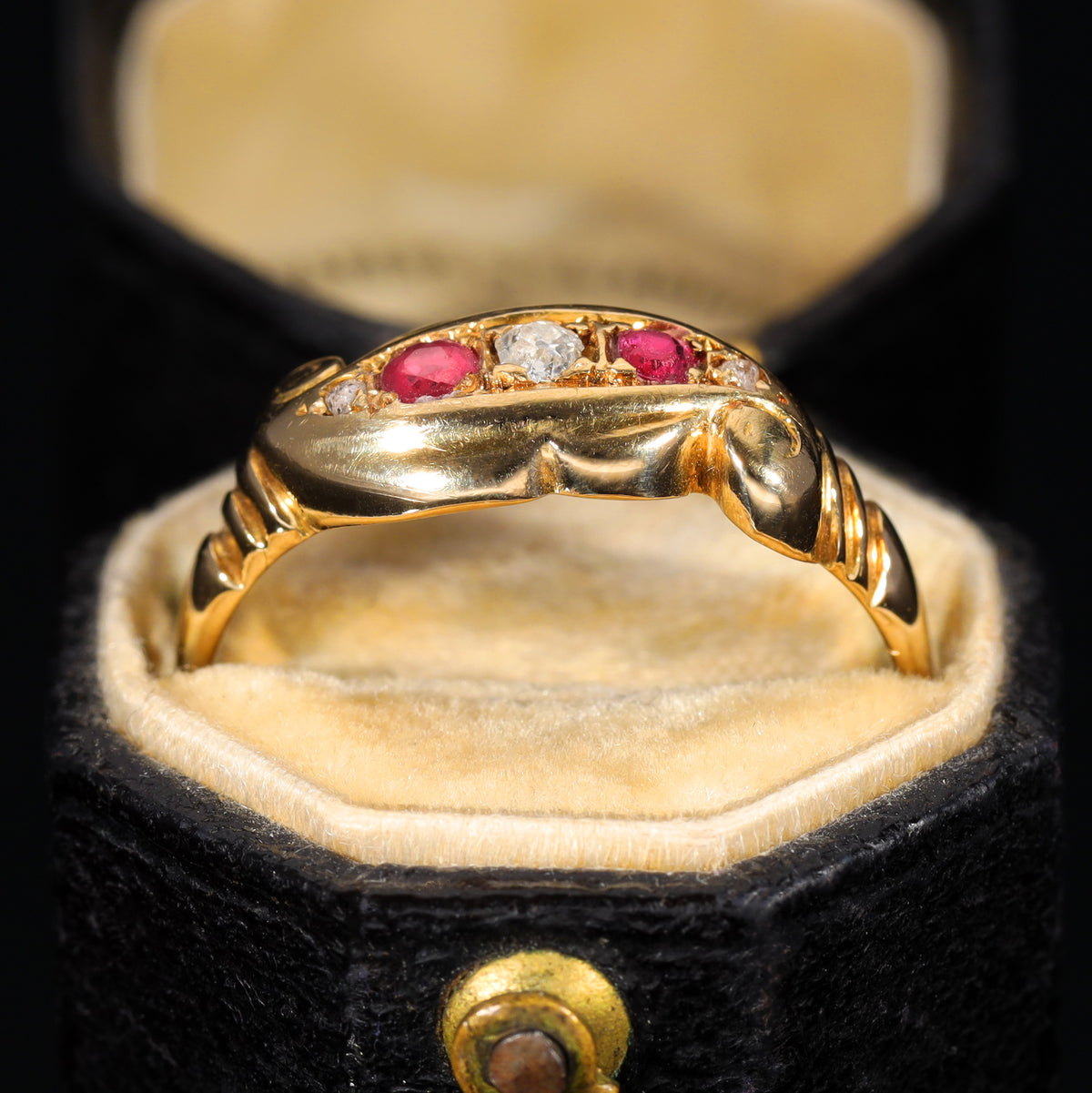 The Antique 1919 Diamond and Ruby Scroll Ring