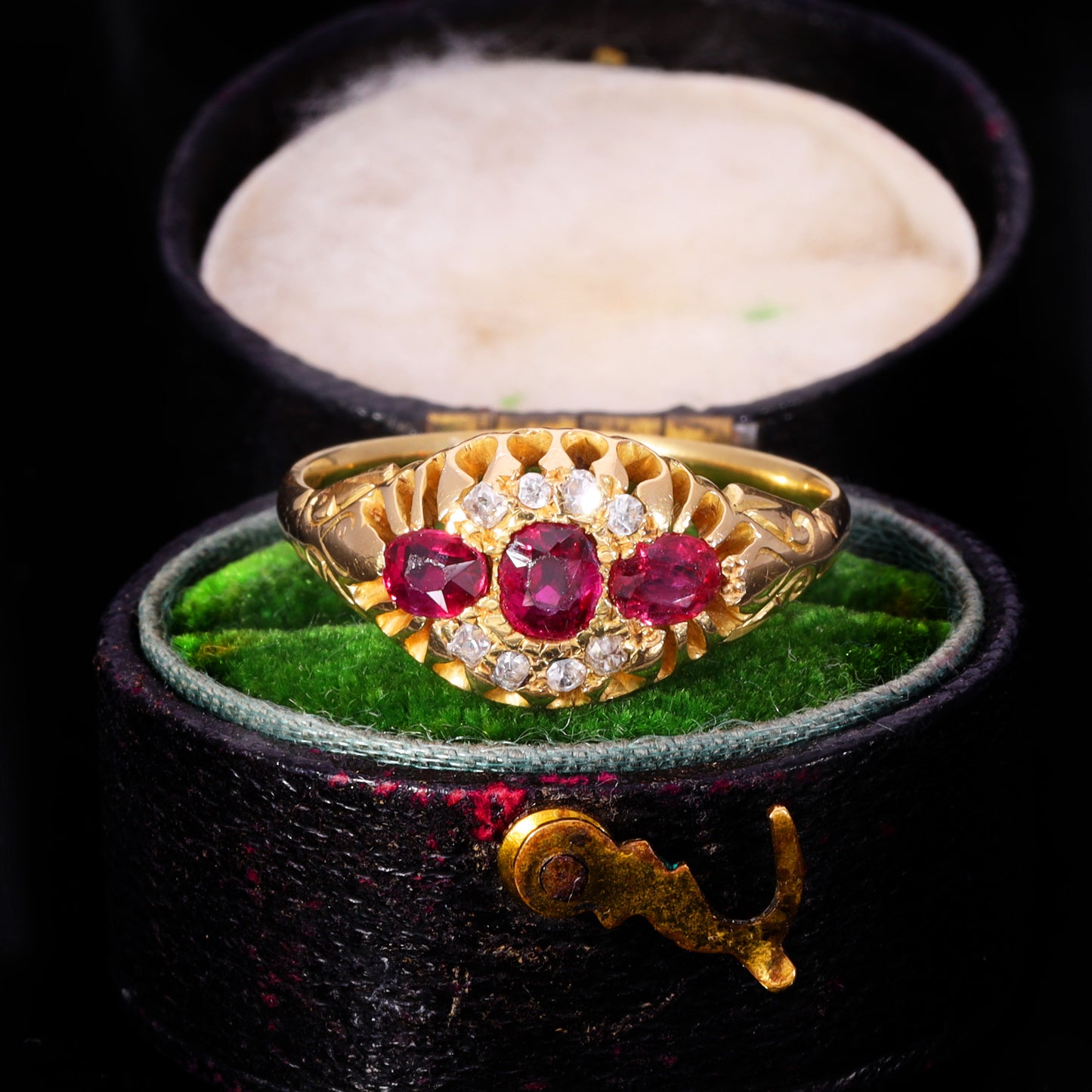 Front view of Victorian ruby and old cut diamond cluster ring in 18ct gold