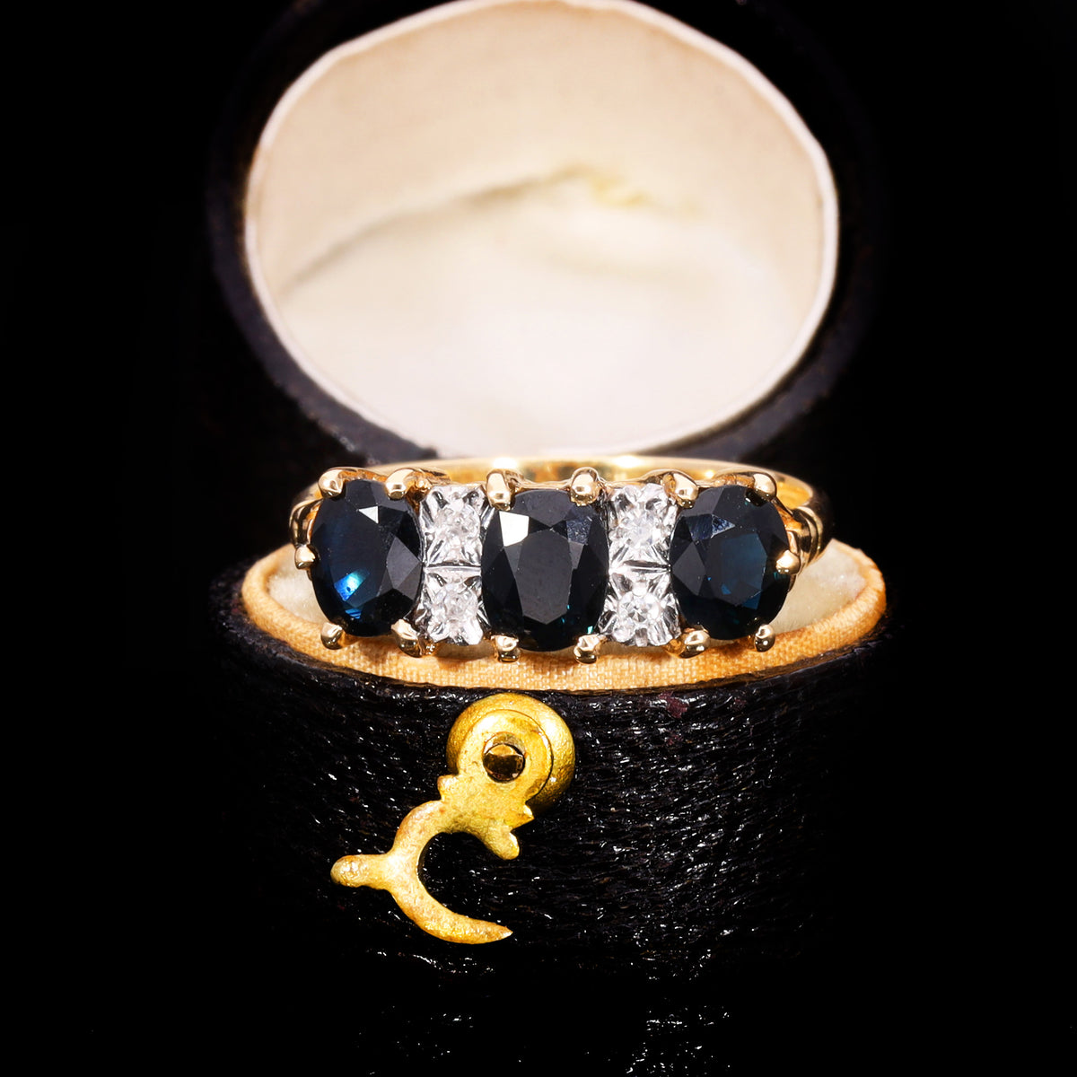 The Vintage 1979 Three Cushion Cut Sapphire And Diamond Ring