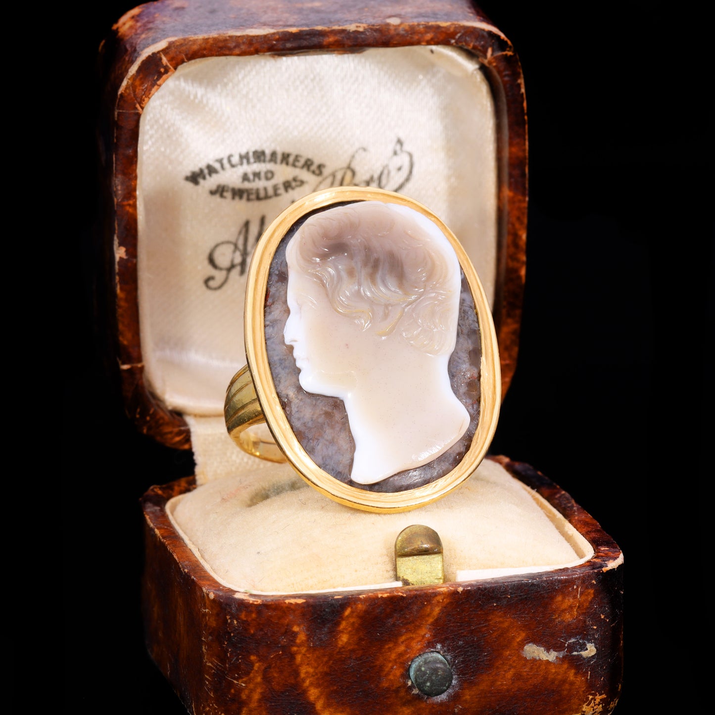 Front view of 17th century sardonyx cameo ring depicting male profile in gold mount