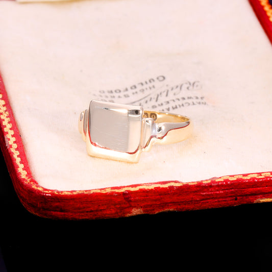 Three-quarter view of Victorian 9ct gold square signet ring with stepped shoulders