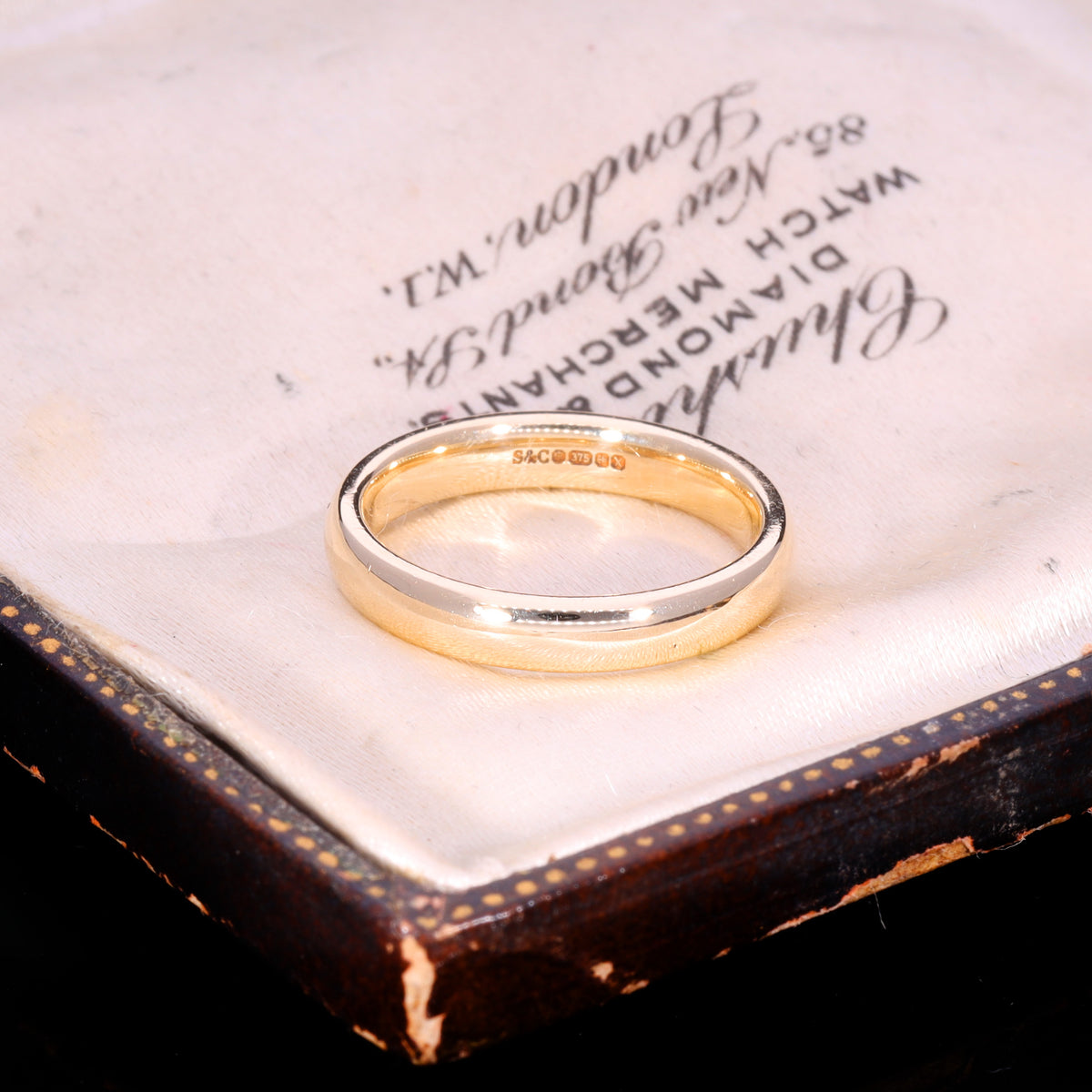 Hallmark stamps on inner band of 9ct gold court wedding ring