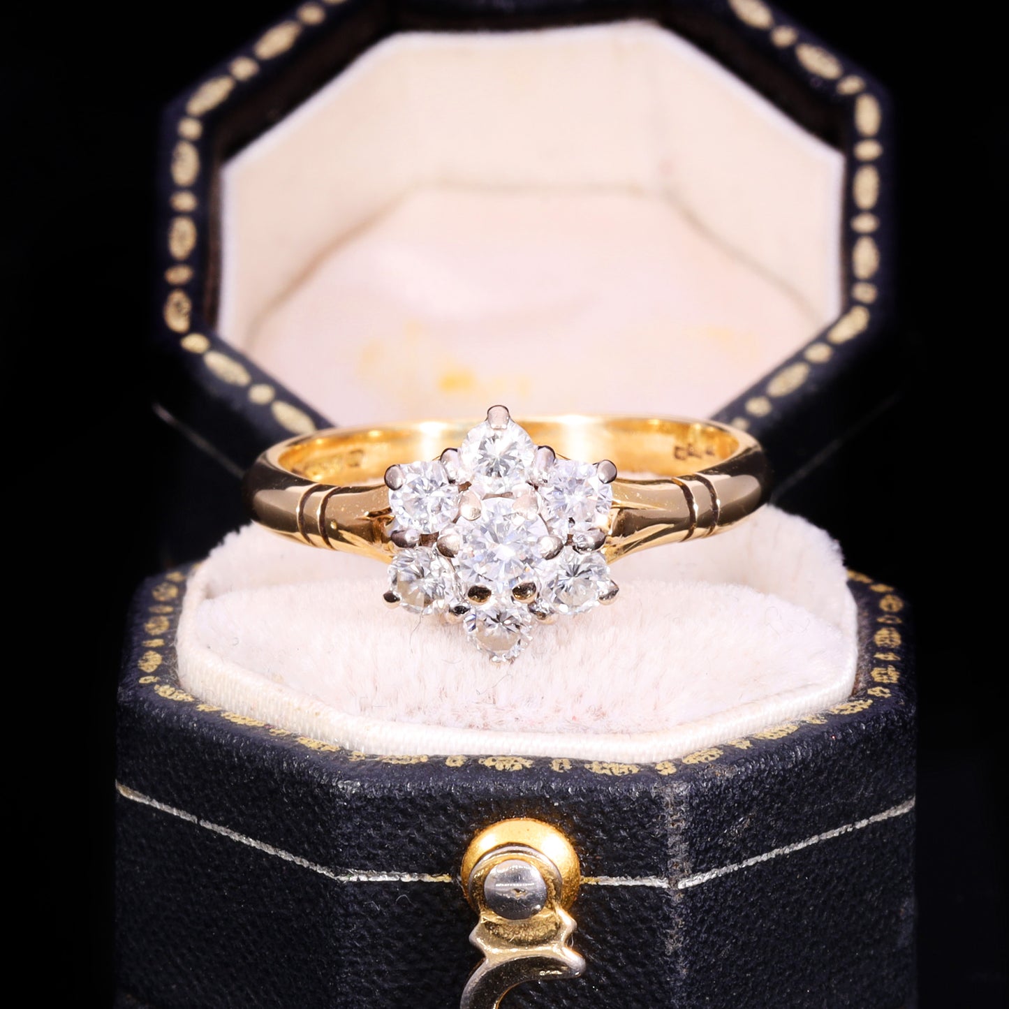 Front view of 1989 18ct gold seven-stone diamond floral cluster ring