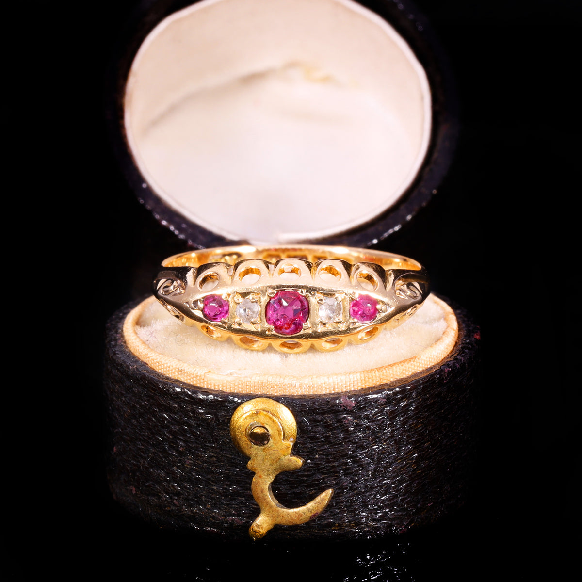 Front view of Edwardian 18ct gold five-stone ruby and diamond boat ring