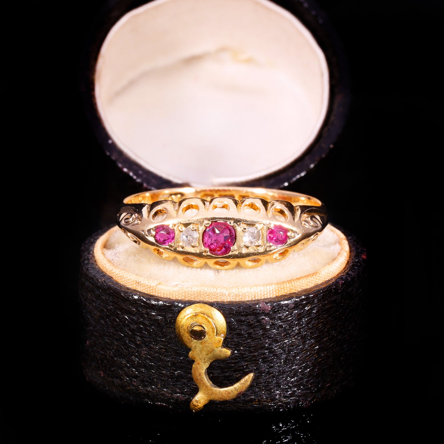 Front view of Edwardian 18ct gold five-stone ruby and diamond boat ring