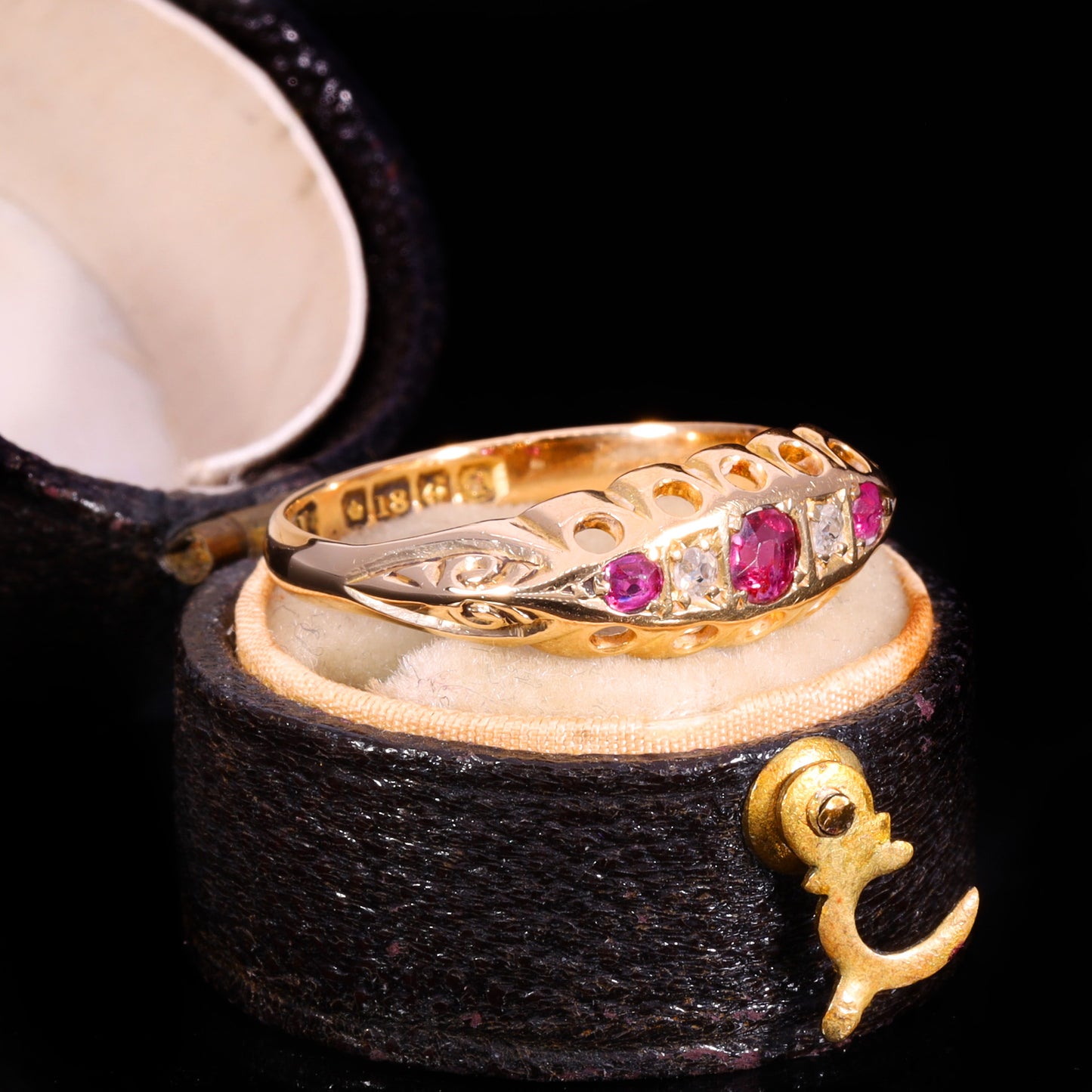 Three-quarter view of Edwardian 18ct gold ruby and diamond five-stone boat ring