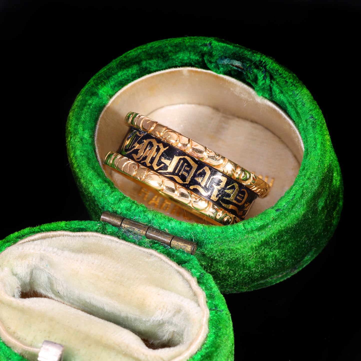 Gold and black enamel mourning band with Gothic lettering "In Memory Of"