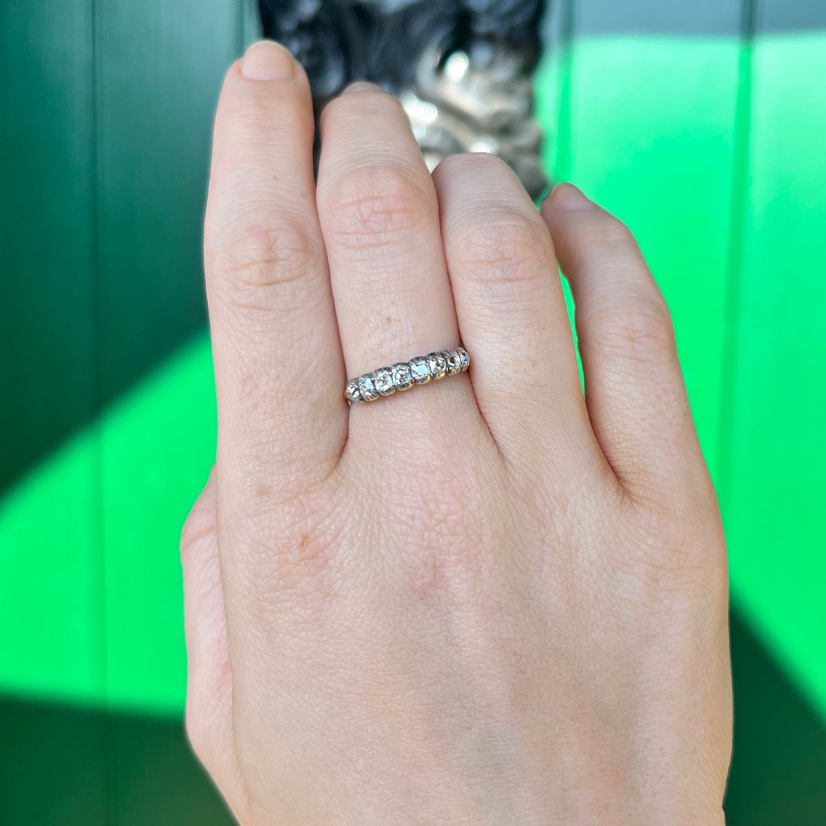 Ring worn on hand showing scale of Victorian diamond half hoop band
