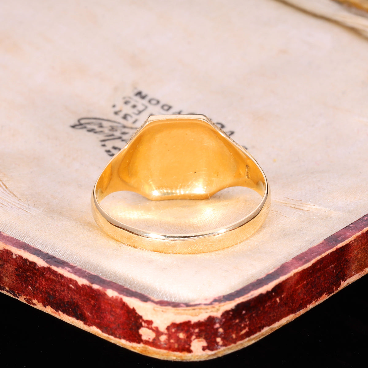 Underside view of Victorian 18ct gold signet ring showing domed interior and plain band