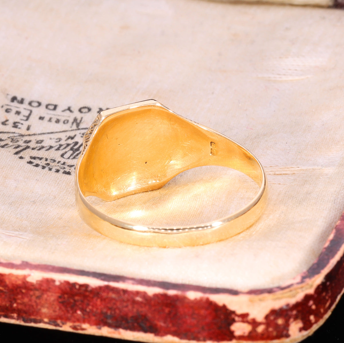 Underside view showing hollow domed interior and London hallmarks on shank